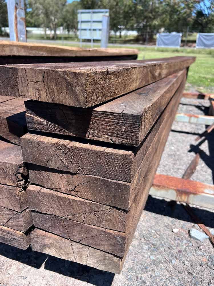 A Stack Of Wooden Boards Sitting On Top Of Each Other — Cooroy Landscape Supplies and Garden Centre in Gympie, QLD