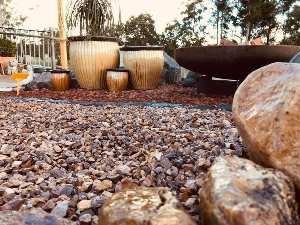 A Group Of Pots Sitting On Top Of A Pile Of Gravel — Cooroy Landscape Supplies And Garden Centre In Noosa, QLD