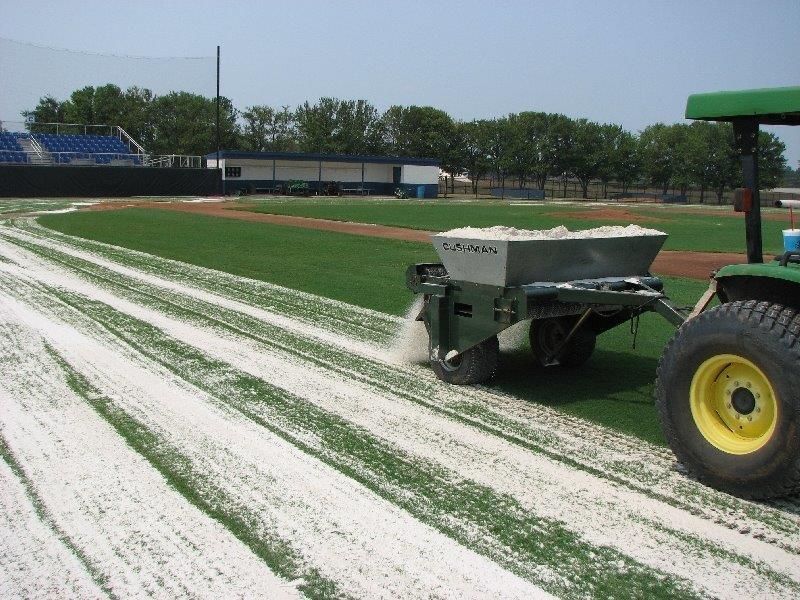 A Tractor Is Spreading Fertilizer on A Baseball Field — Cooroy Landscape Supplies and Garden Centre in Cooroy, QLD
