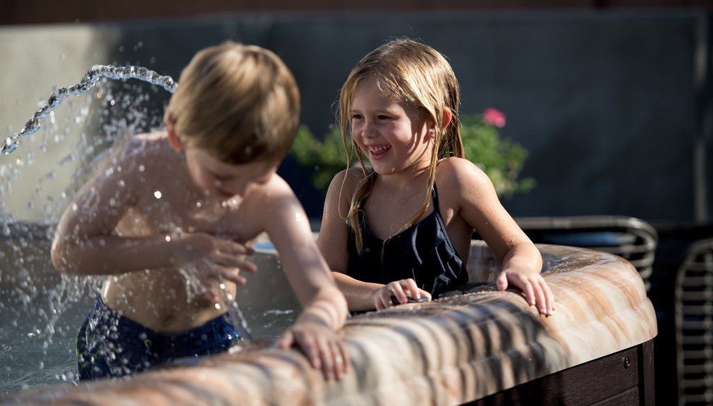 kids enjoying the hot tub