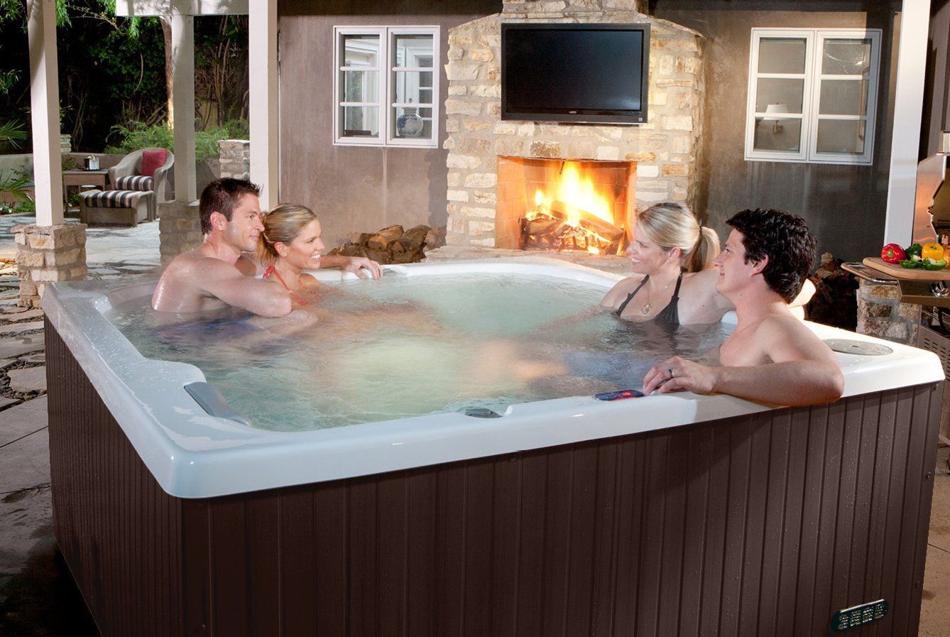 couples enjoying a night in the hot tub