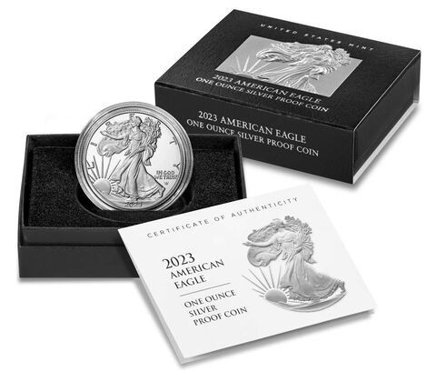 a silver coin in a box with a certificate of authenticity .
