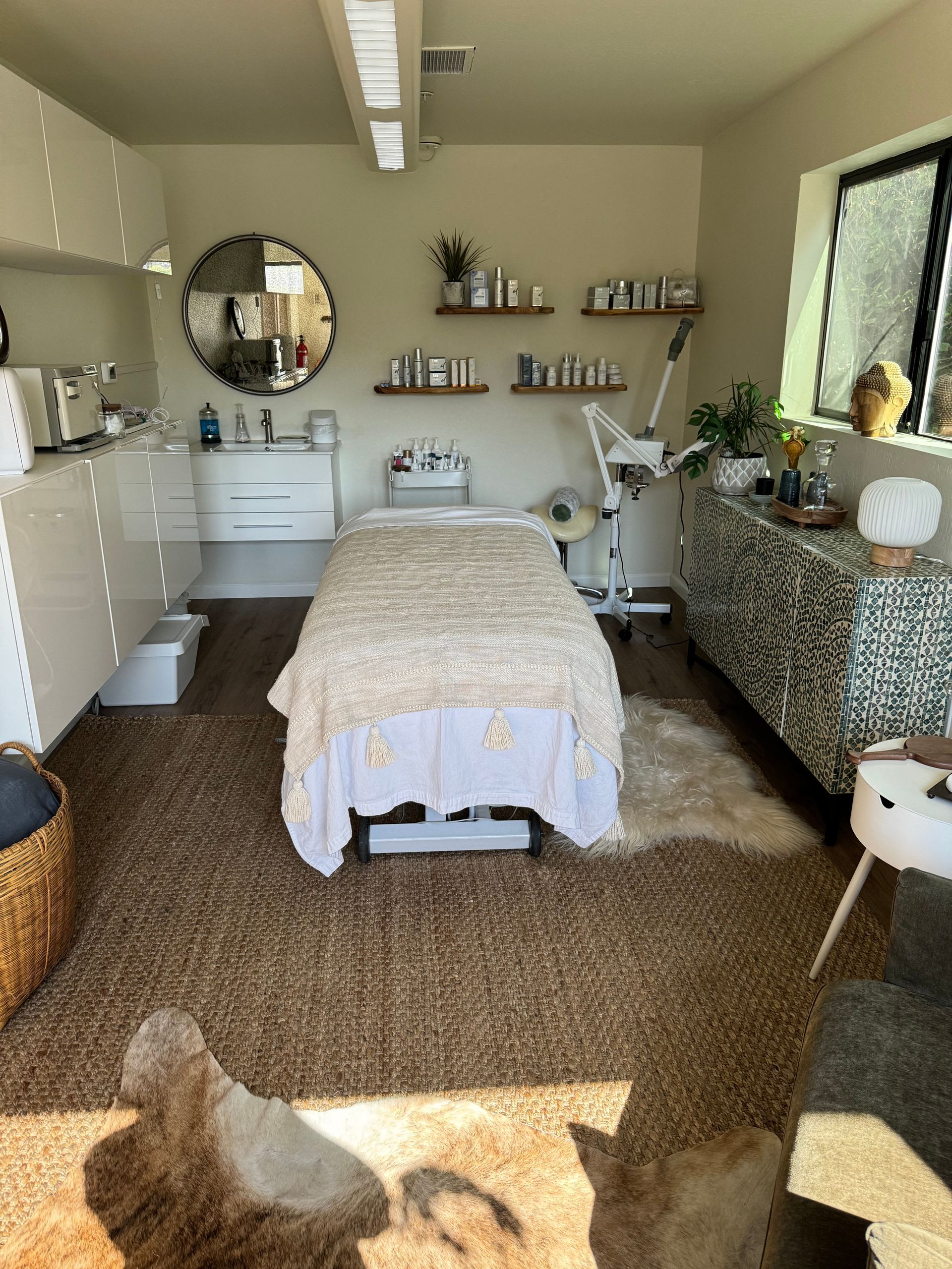 There is a massage table in the middle of the room.