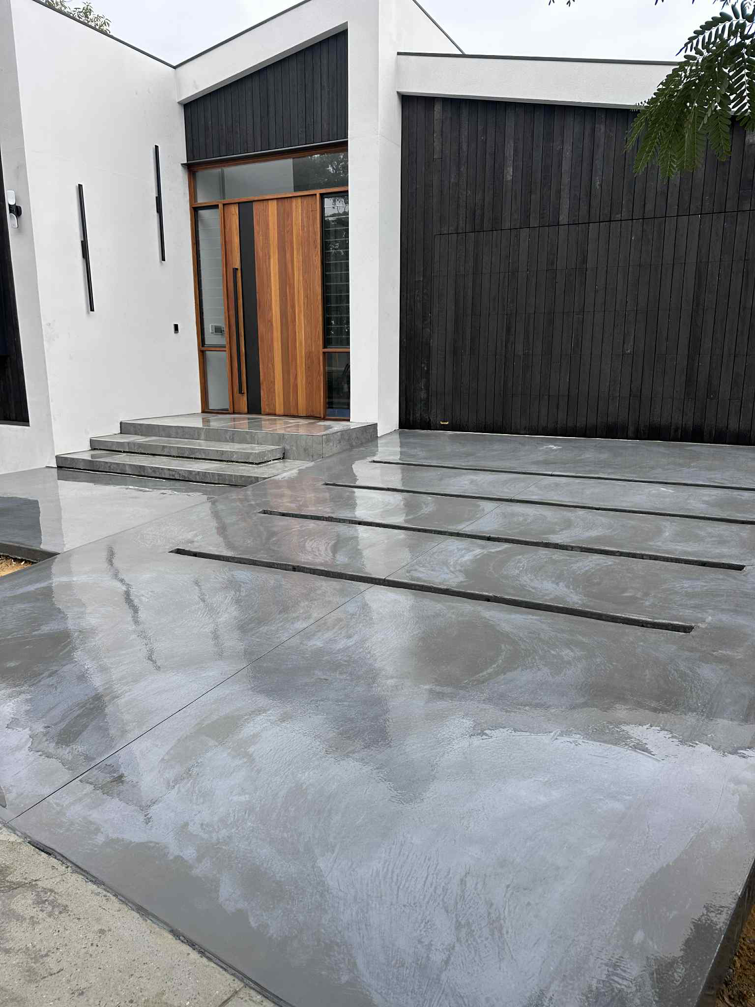 Architectural grey concrete driveway and stairs in Perth