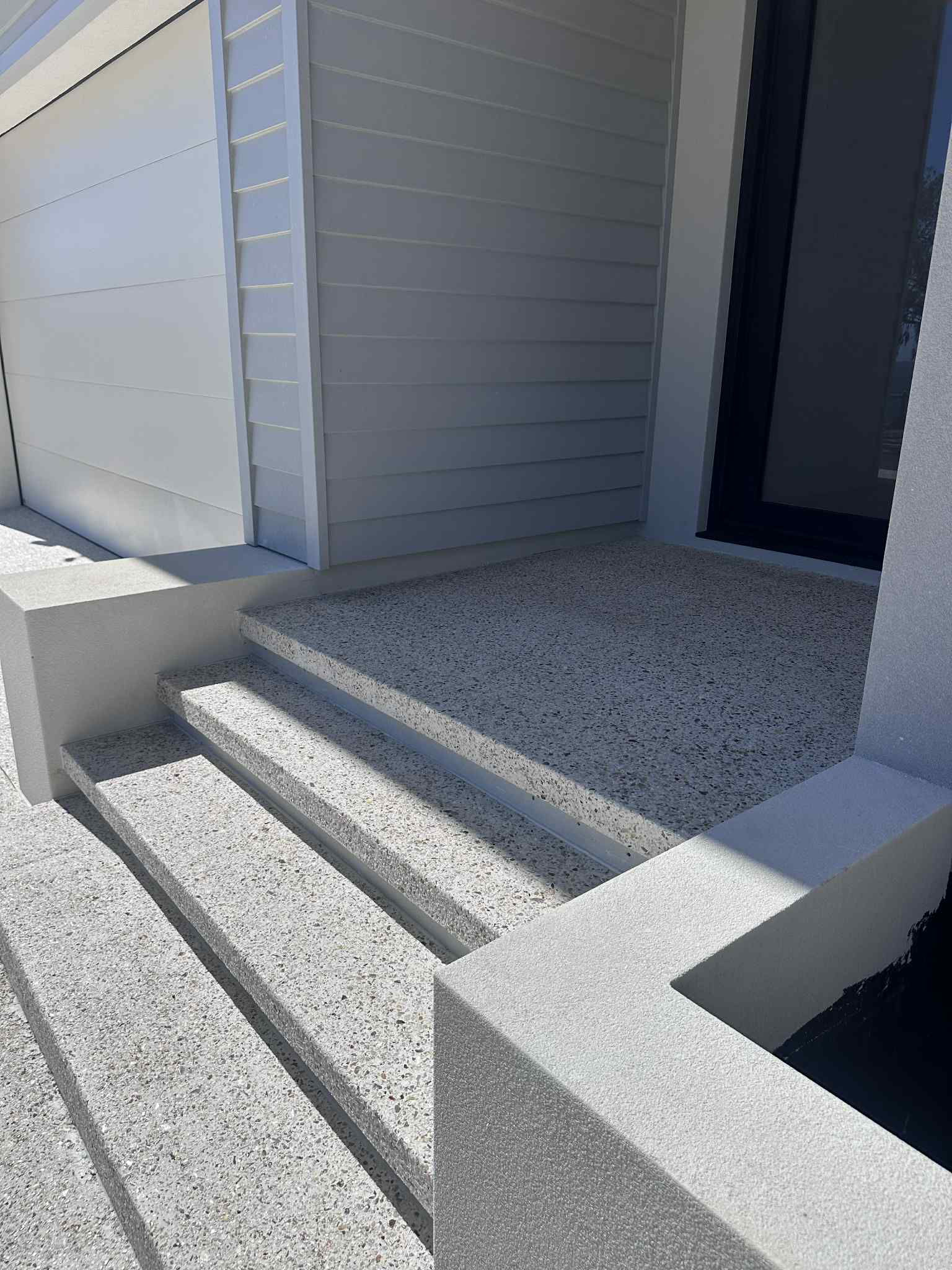 Exposed aggregate set of 3 steps upto the front door of Perth home