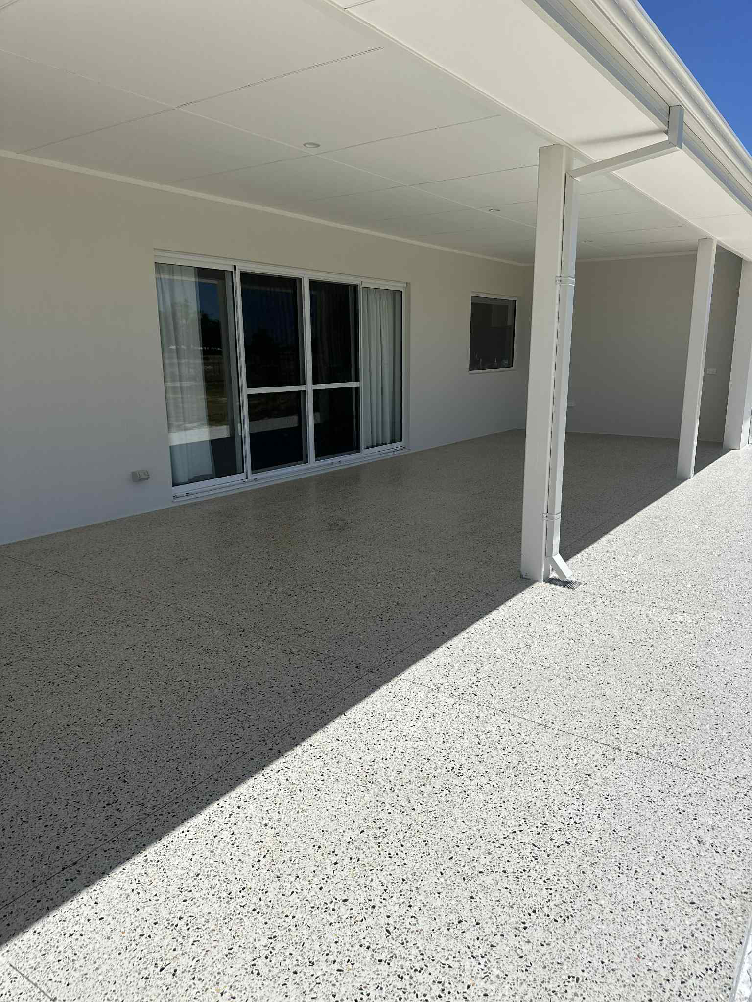 New home build with honed concrete alfresco flooring