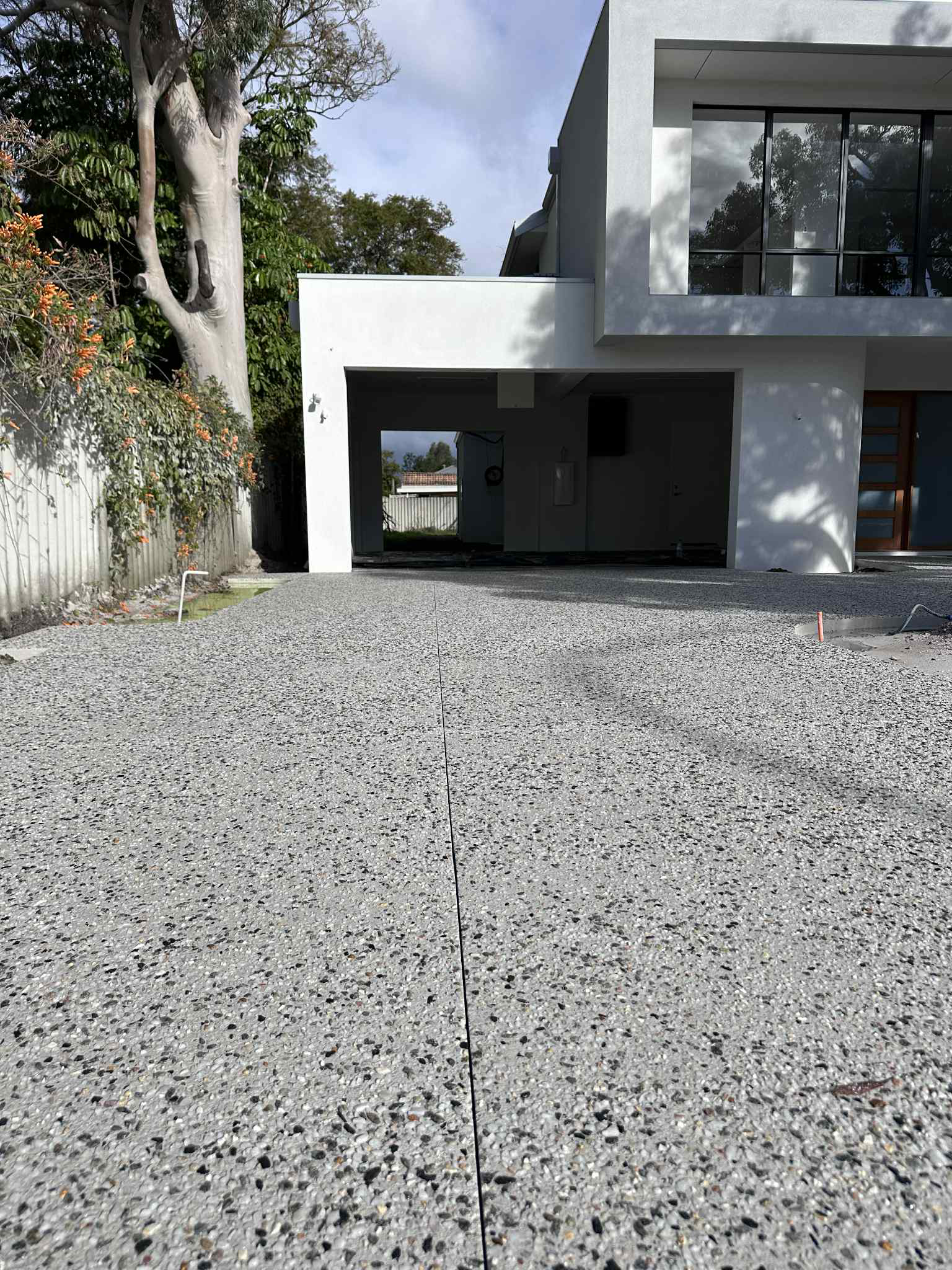 Exposed aggregate driveway leading to two storey home in Perth