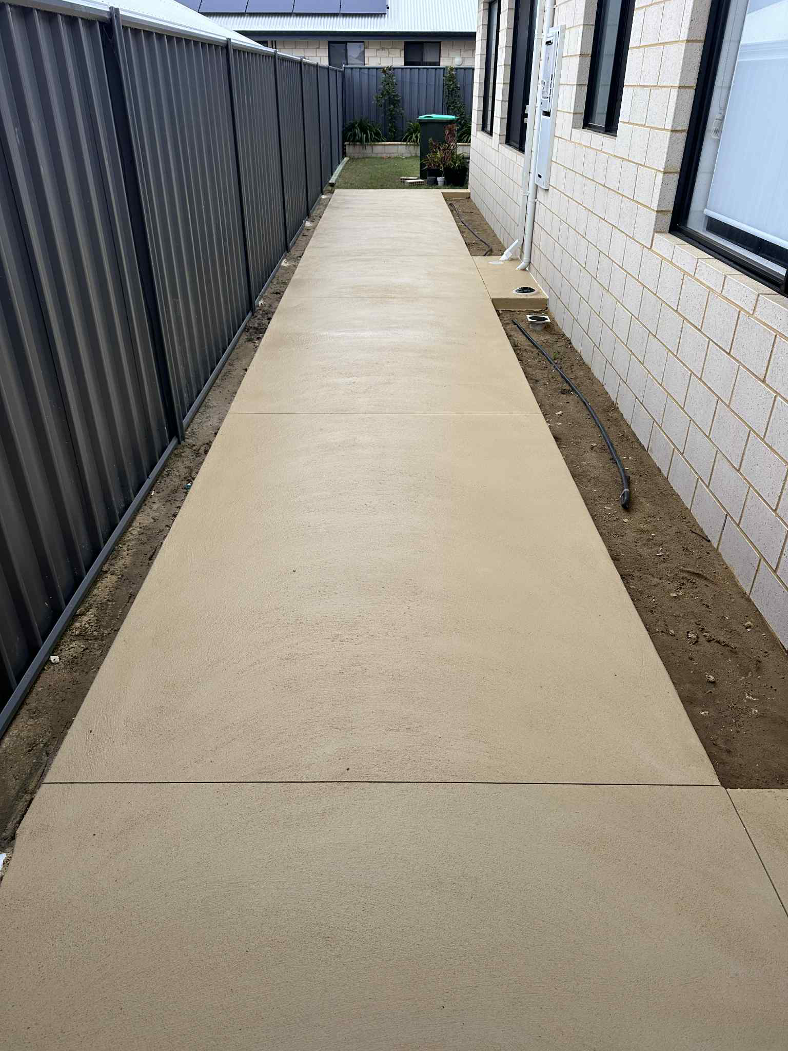 Liquid limestone path down the side of a Scarborough home