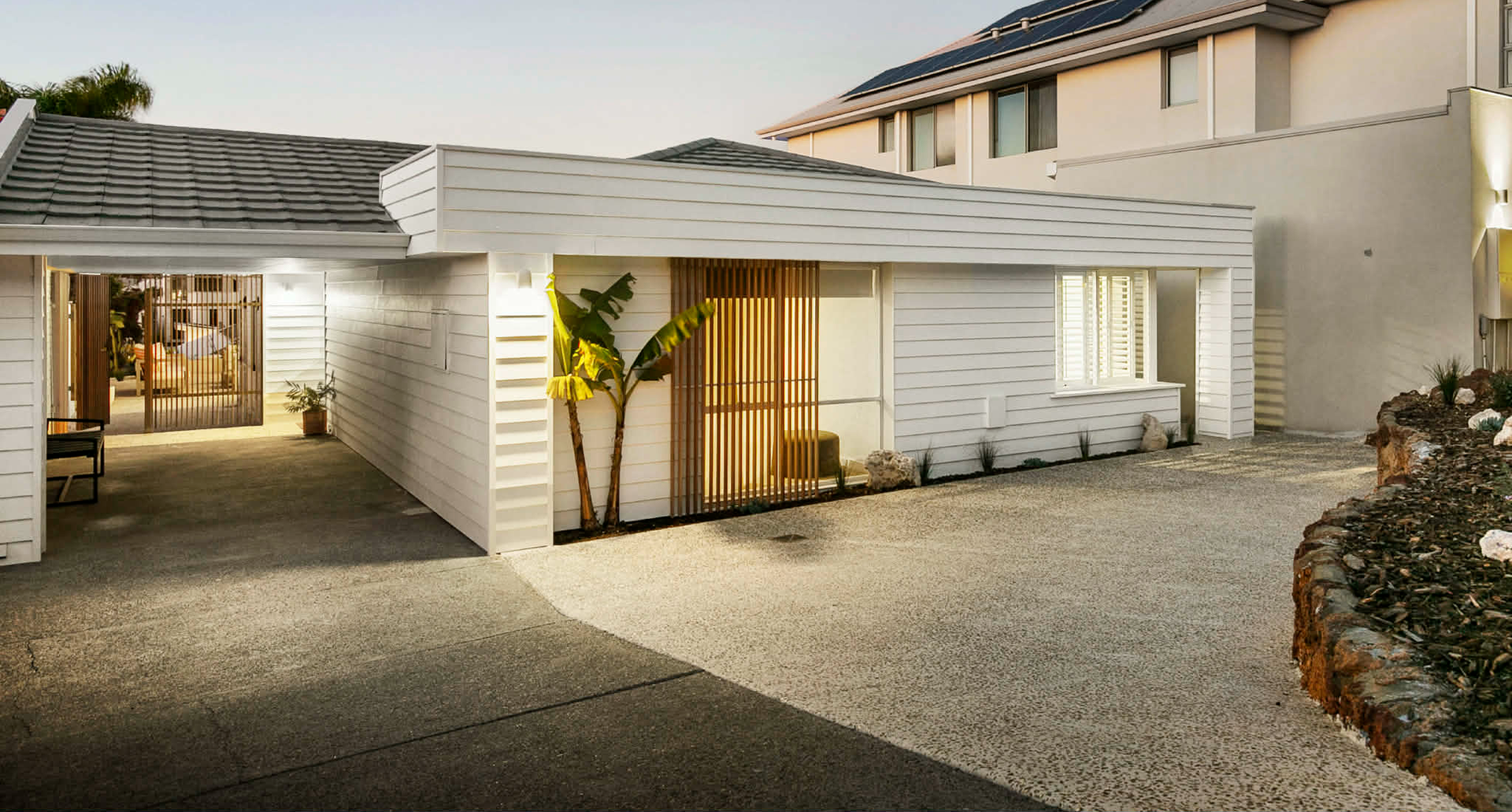 Exposed aggregate concrete mix in front of house entrance for house renovation in North Beach