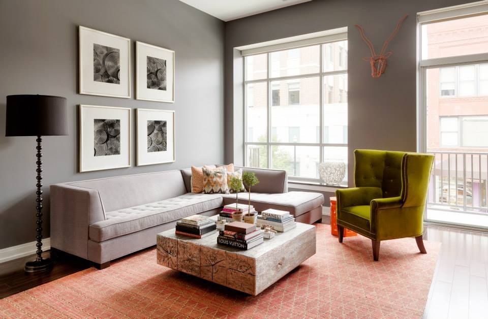 A living room with a couch , chair and coffee table
