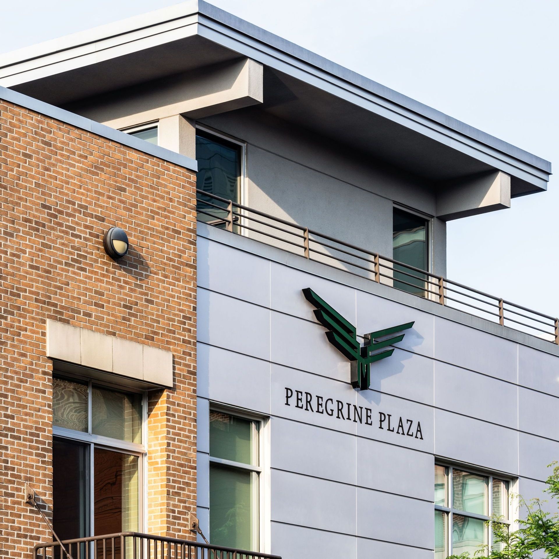 The peregrine plaza building has a balcony on the top of it