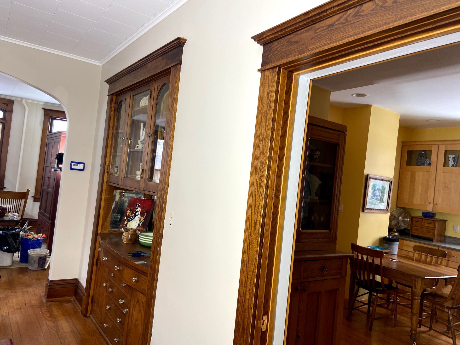 A hallway leading to a kitchen and dining room