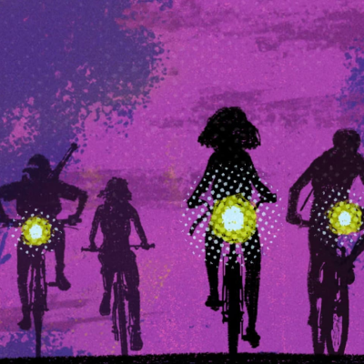 Silhouettes of four people riding bikes at dusk, glowing lights on backs, purple sky.
