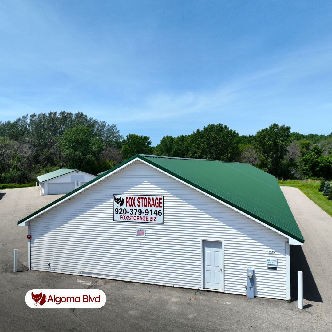White Fox Storage building with green roof, blue sky background. Located on Algoma Blvd.