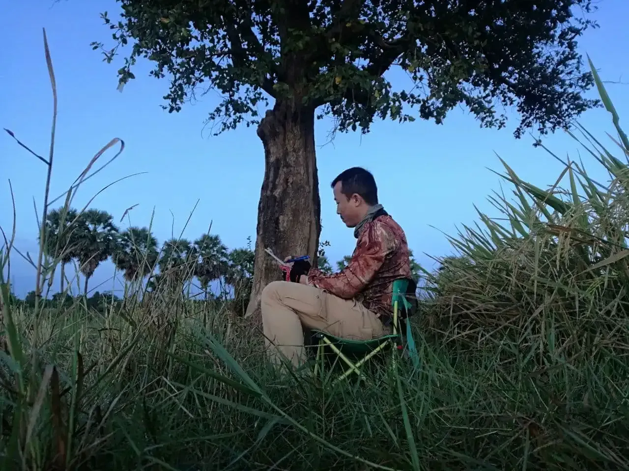 The Sam Veasna Conservation Tour tour guide preparing to get the birding ready