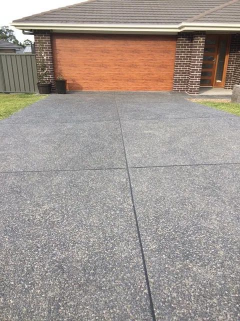 House With Concrete Driveway — East Maitland, NSW — DMK Concrete & Excavations
