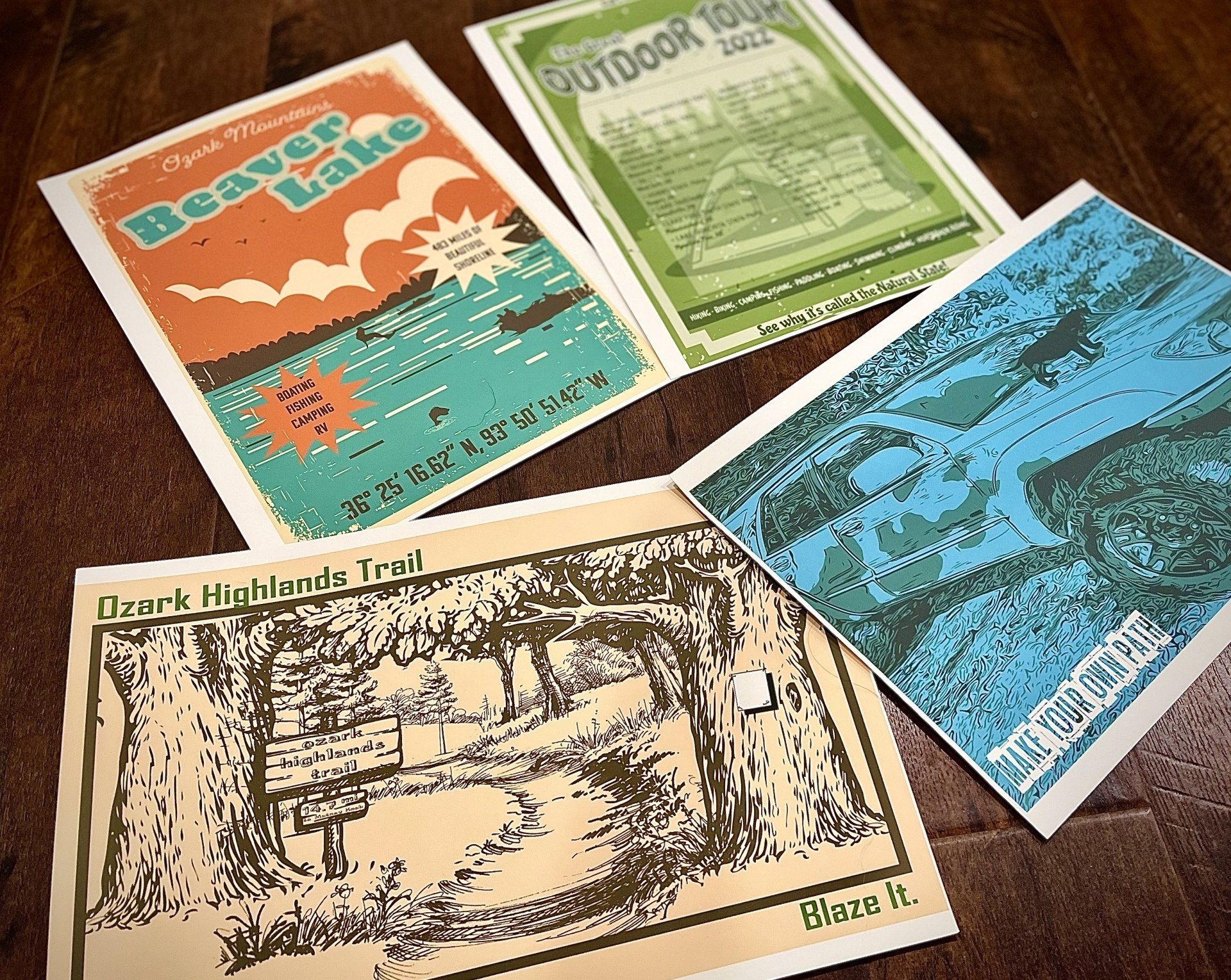 four posters on a table one of which says beaver lake