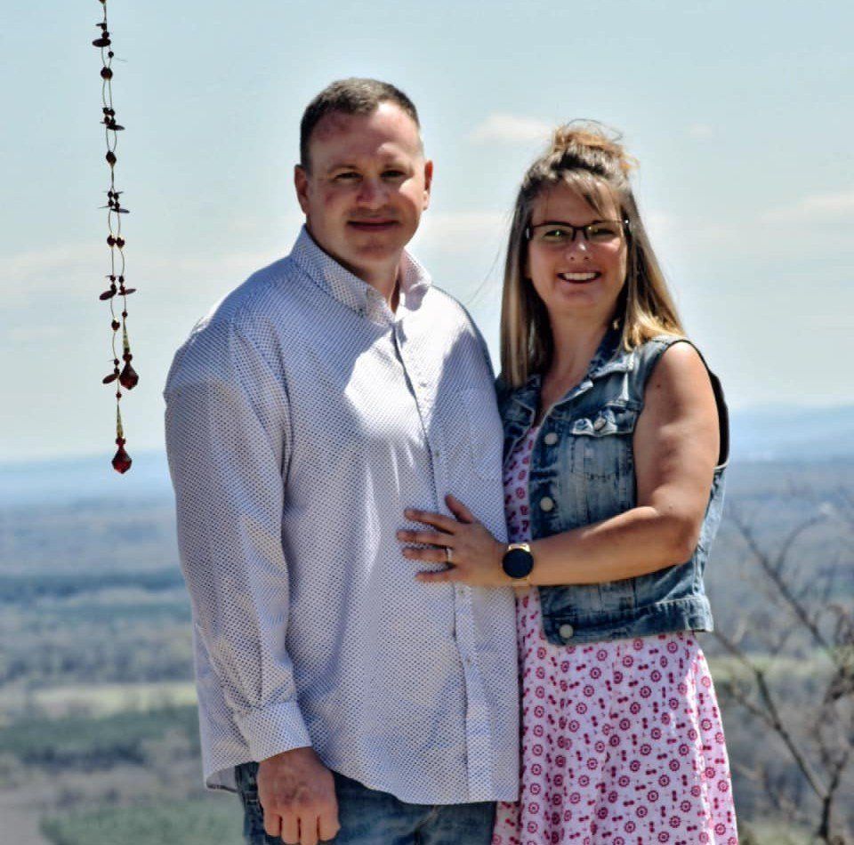 a man and a woman are posing for a picture