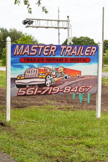 A sign for master trailer trailer repair and rental