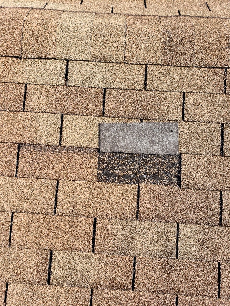 A close up of a roof with a hole in it.