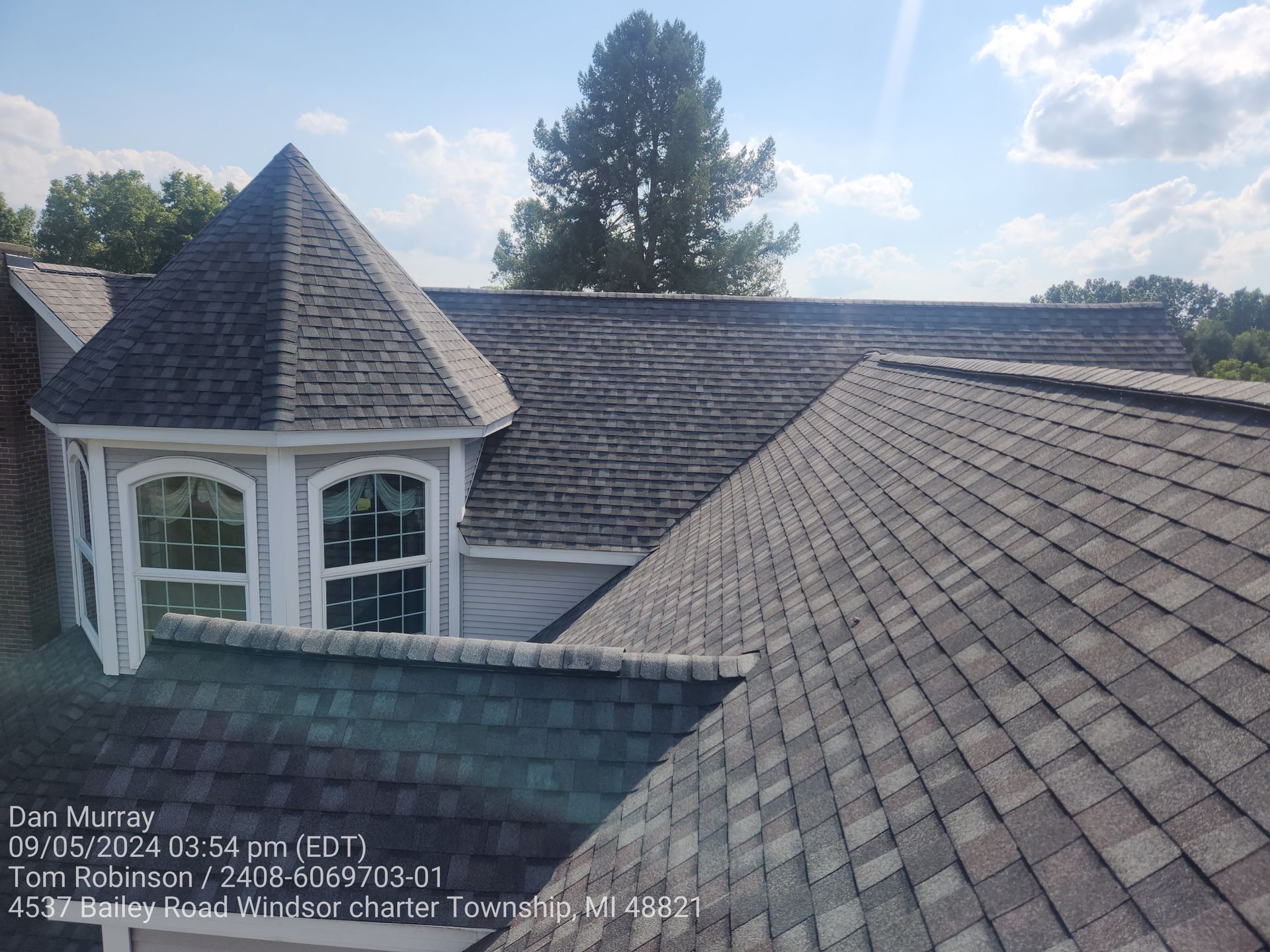 A house with a roof that has shingles on it