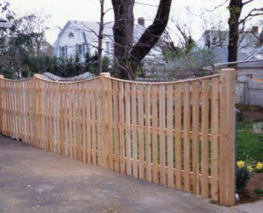 Scalloped spaced board with cap strip and beveled posts