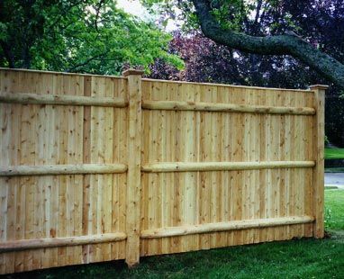 Flat-topped stockade with 1 by 2 caps and 5 by 5 posts
