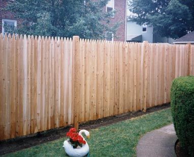 Stockade with round cedar posts