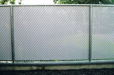 Six-foot chain link with privacy Finn slats