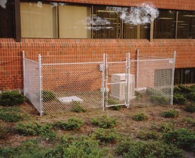 Six-foot chain link with one-foot barbed wire