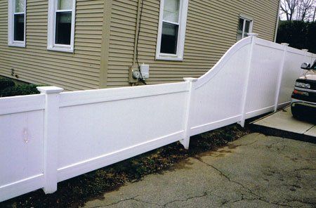 Vinyl six-foot privacy with slope to four-foot high