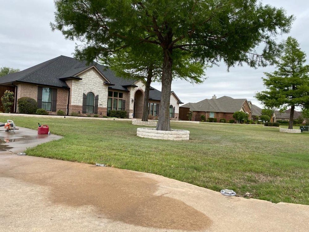 A large house with a tree in front of it