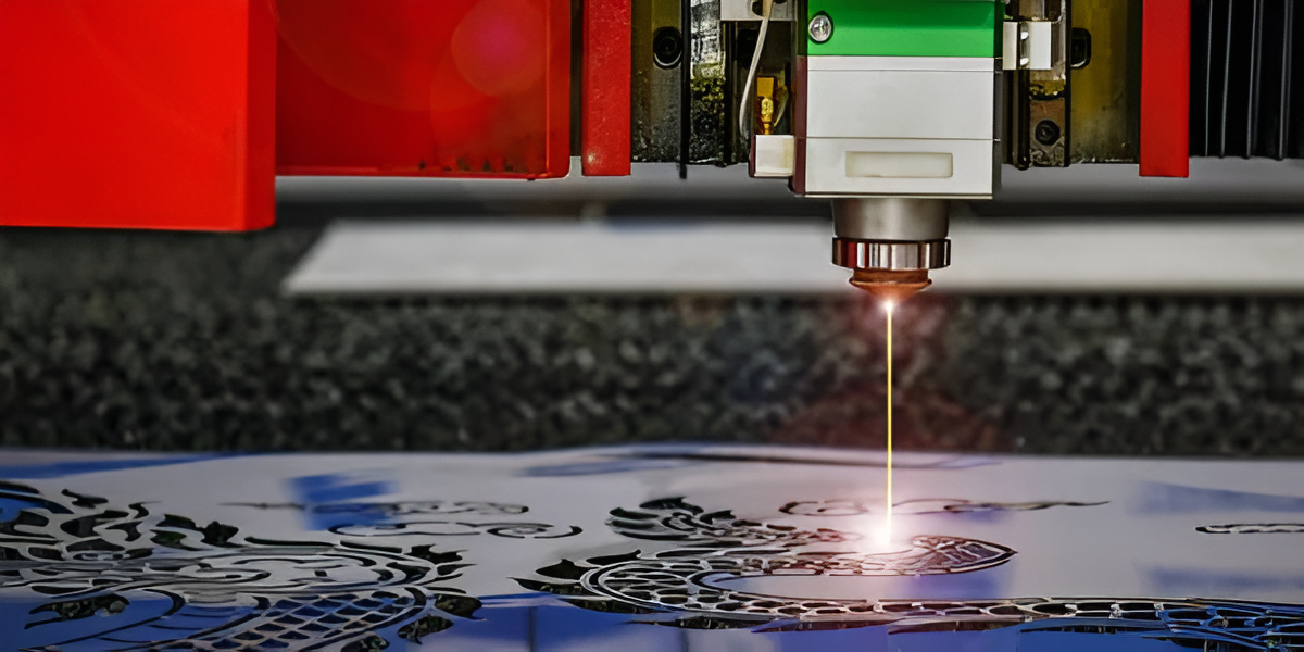 A laser cutting machine cutting intricate designs on a sheet of metal.