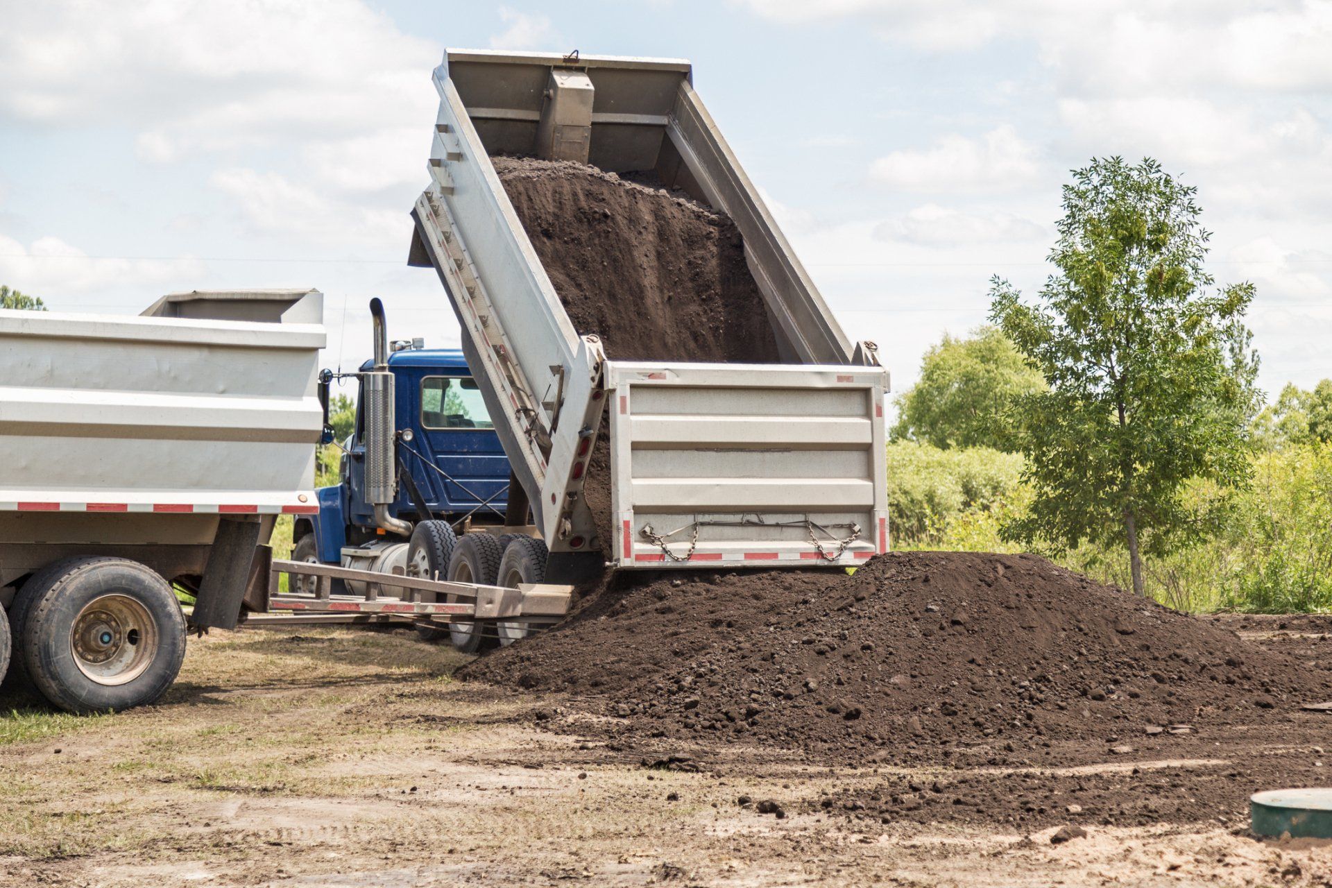 Truck Dumping Soil — Rome, NY — Colucci Trucking