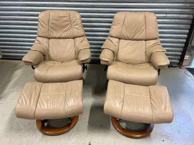 A Pair of Ekornes Reno Leather Reclining Armchairs & Footstools with Headrests