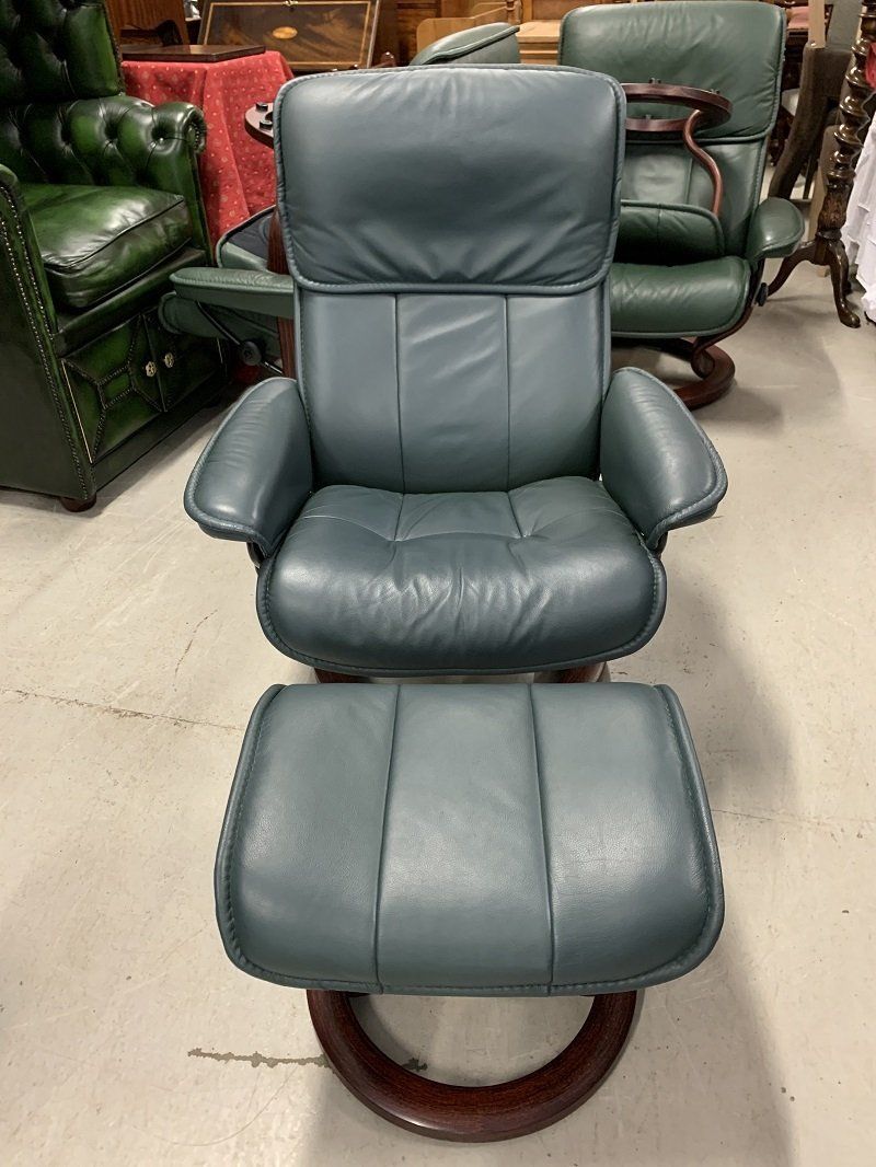 A Pair of Medium Ekornes Reclining Armchairs & Footstools