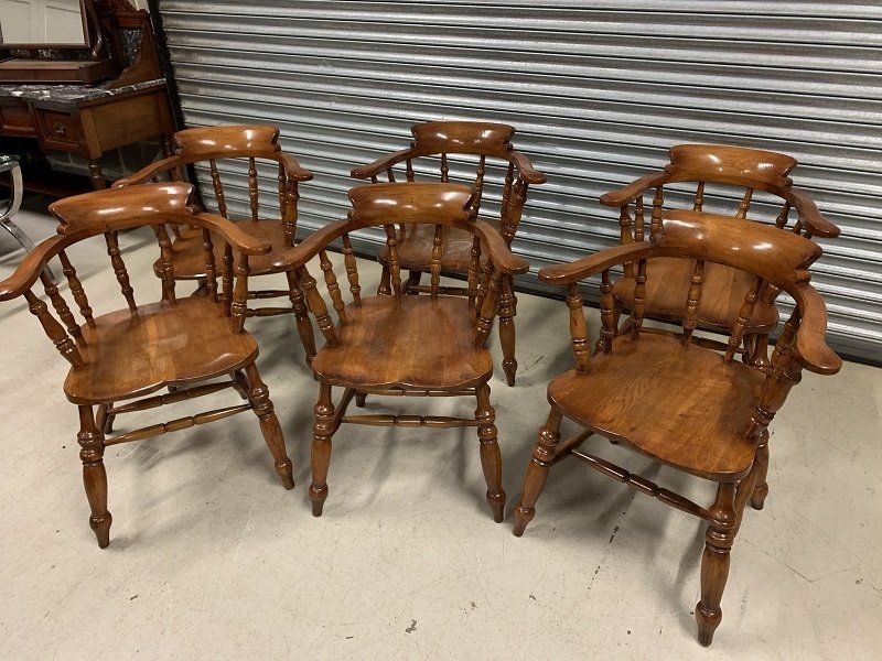 A Stunning Set of Six Rare Oak Bow Back Captains Chairs