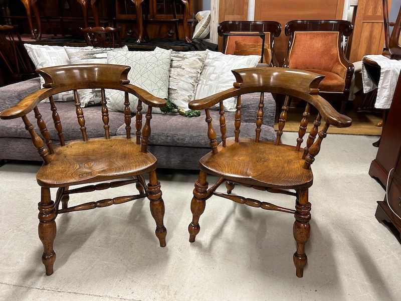A Pair of Antique Solid Elm Bow Back Captain Chairs