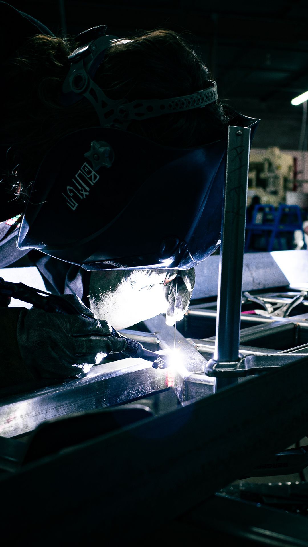 Integrus Team member welding custom metalwork