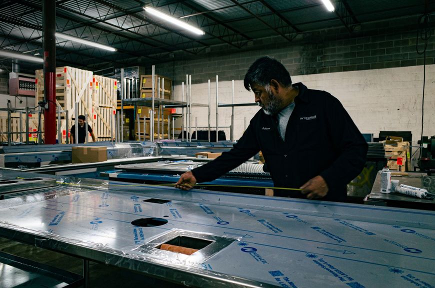 Integrus Fabrication worker Quality Checking (QC) metal fabricated food service equipment
