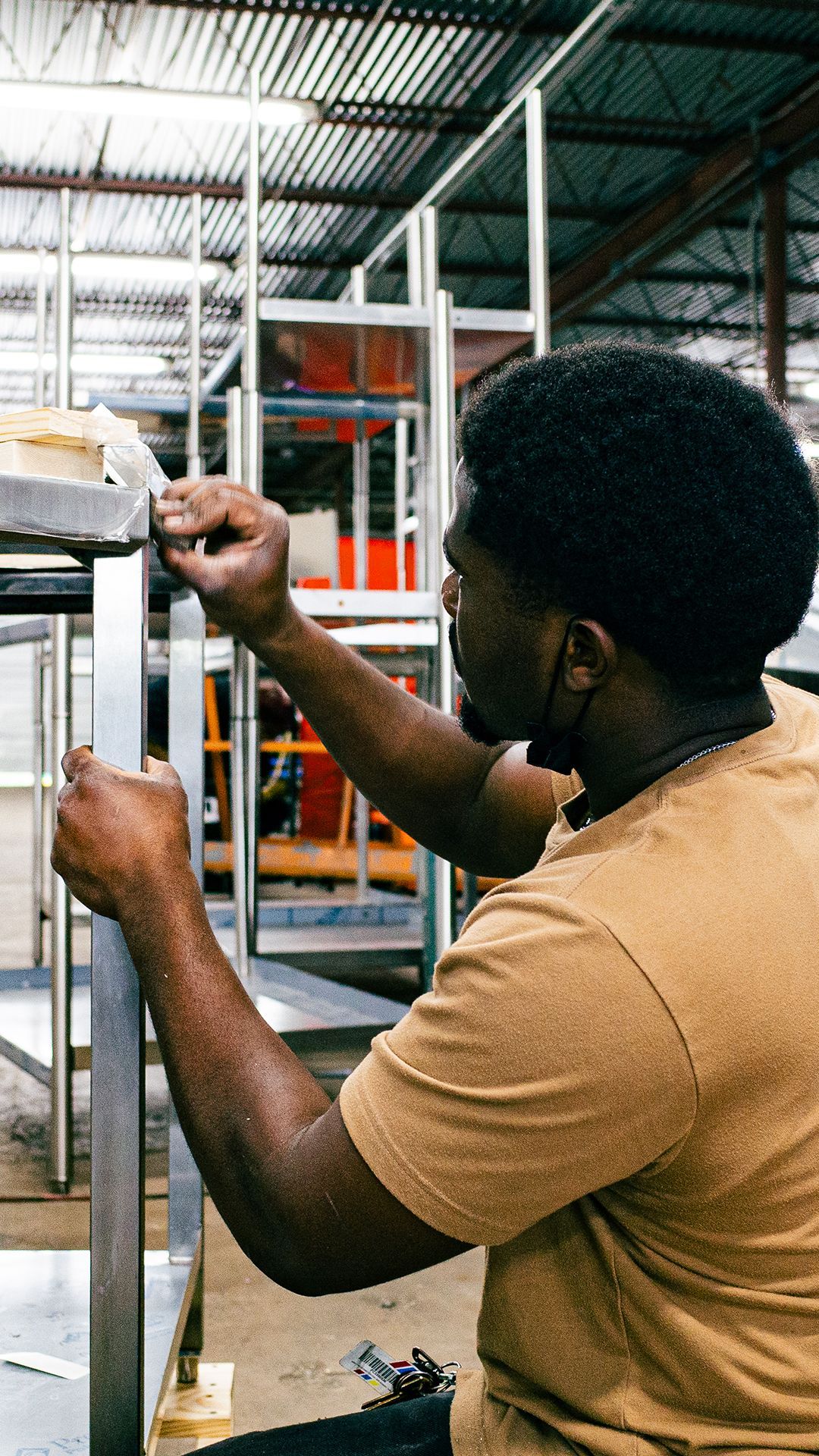 Integrus Team member polishing custom metalwork