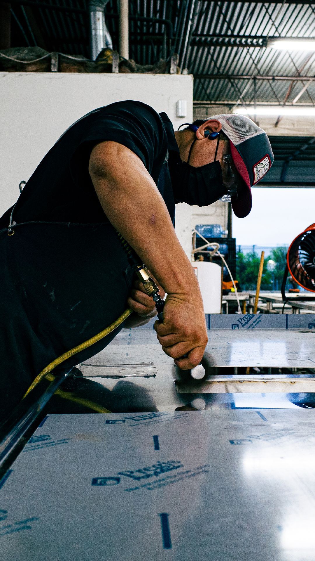 Integrus Team member polishing custom metalwork