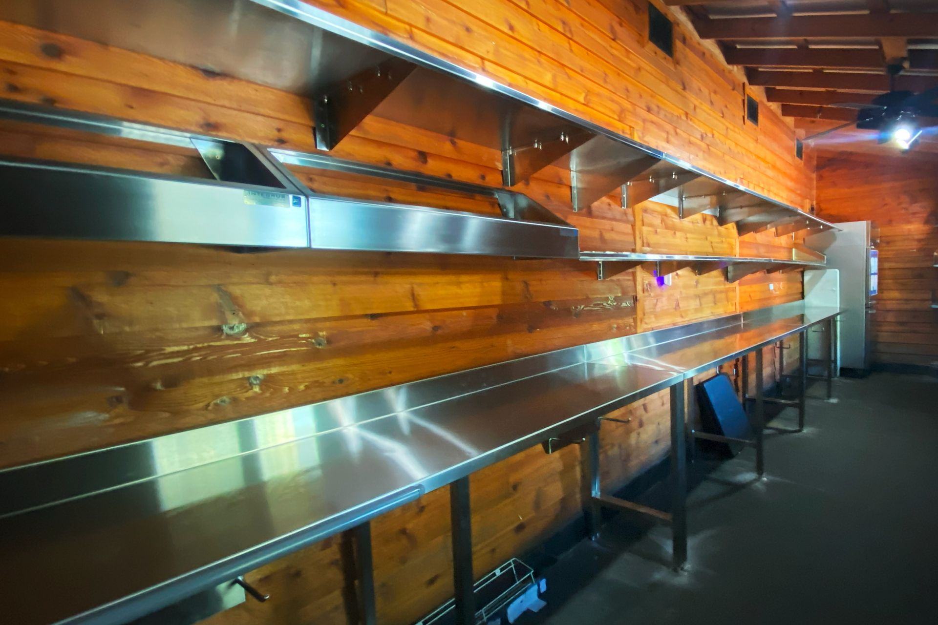 Photo of Packing station with panholders, worktables, and shelves