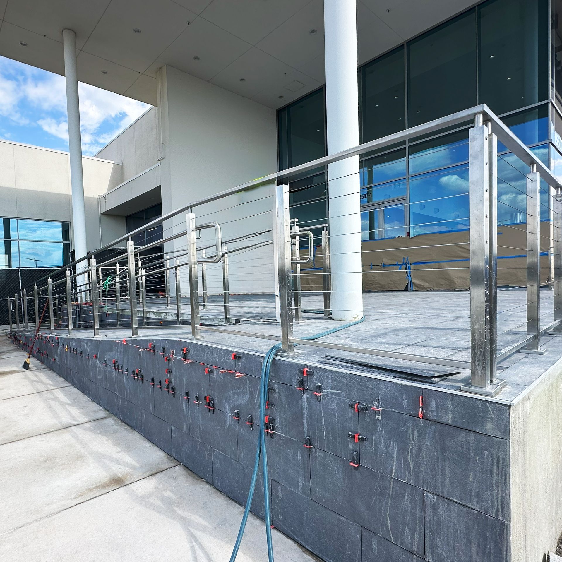 Phot of staircase cable handrail installed at Principle BMW in San Antonio
