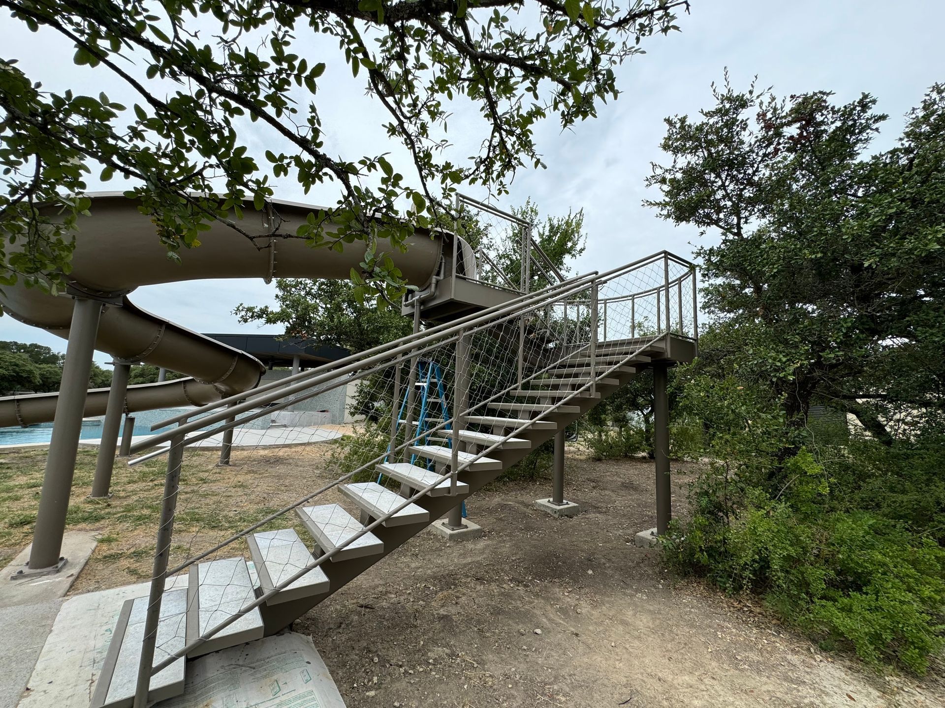 Photo of residential metal fabricated pool stairs and slide