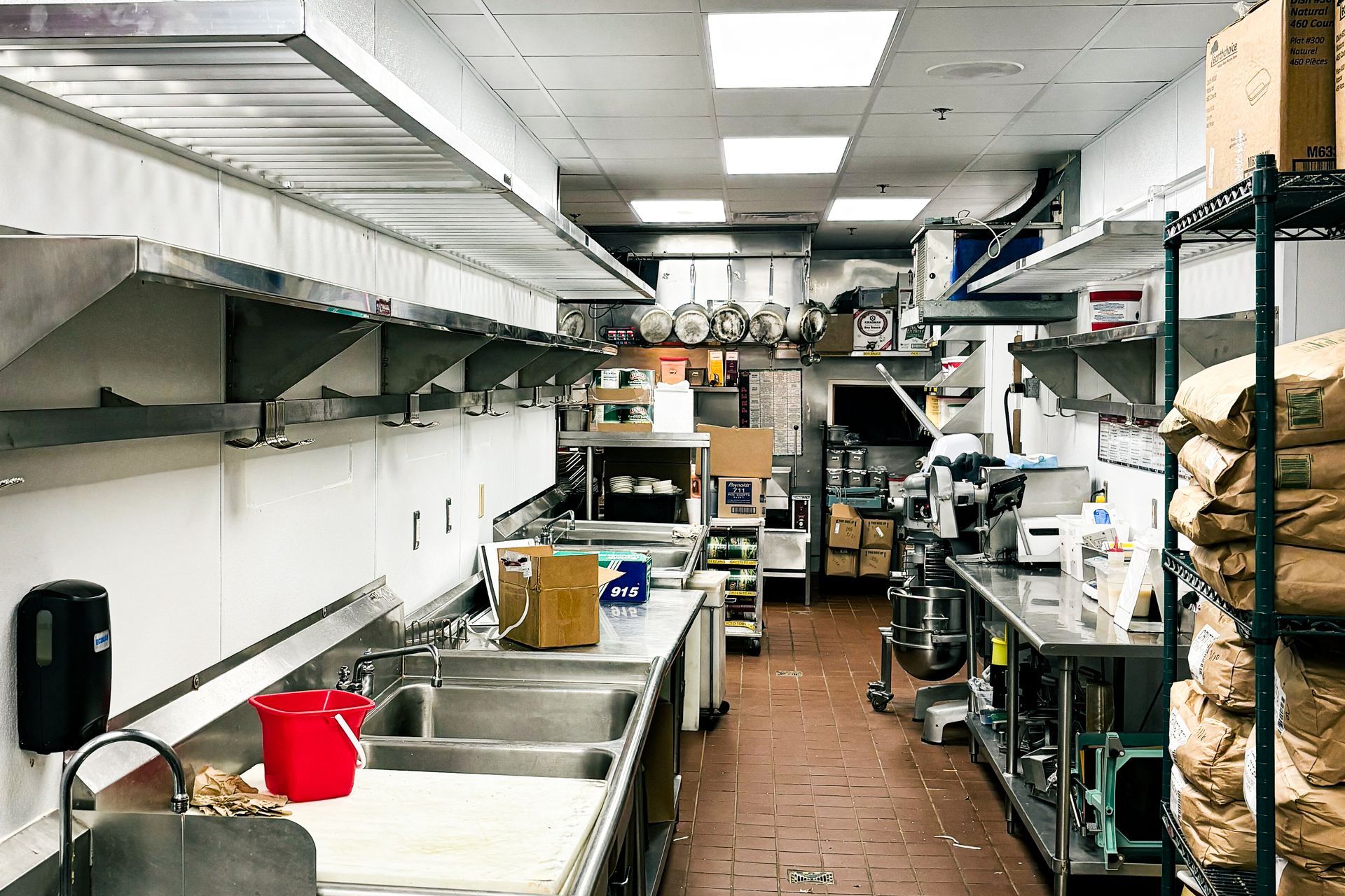 A kitchen with stainless steel appliances and a sink.