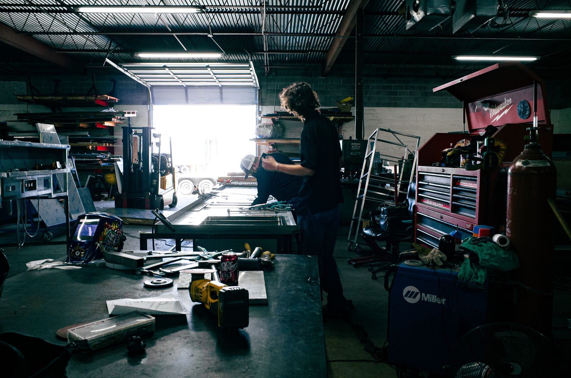Two Integrus Fabrication team members/welders working together on a project.