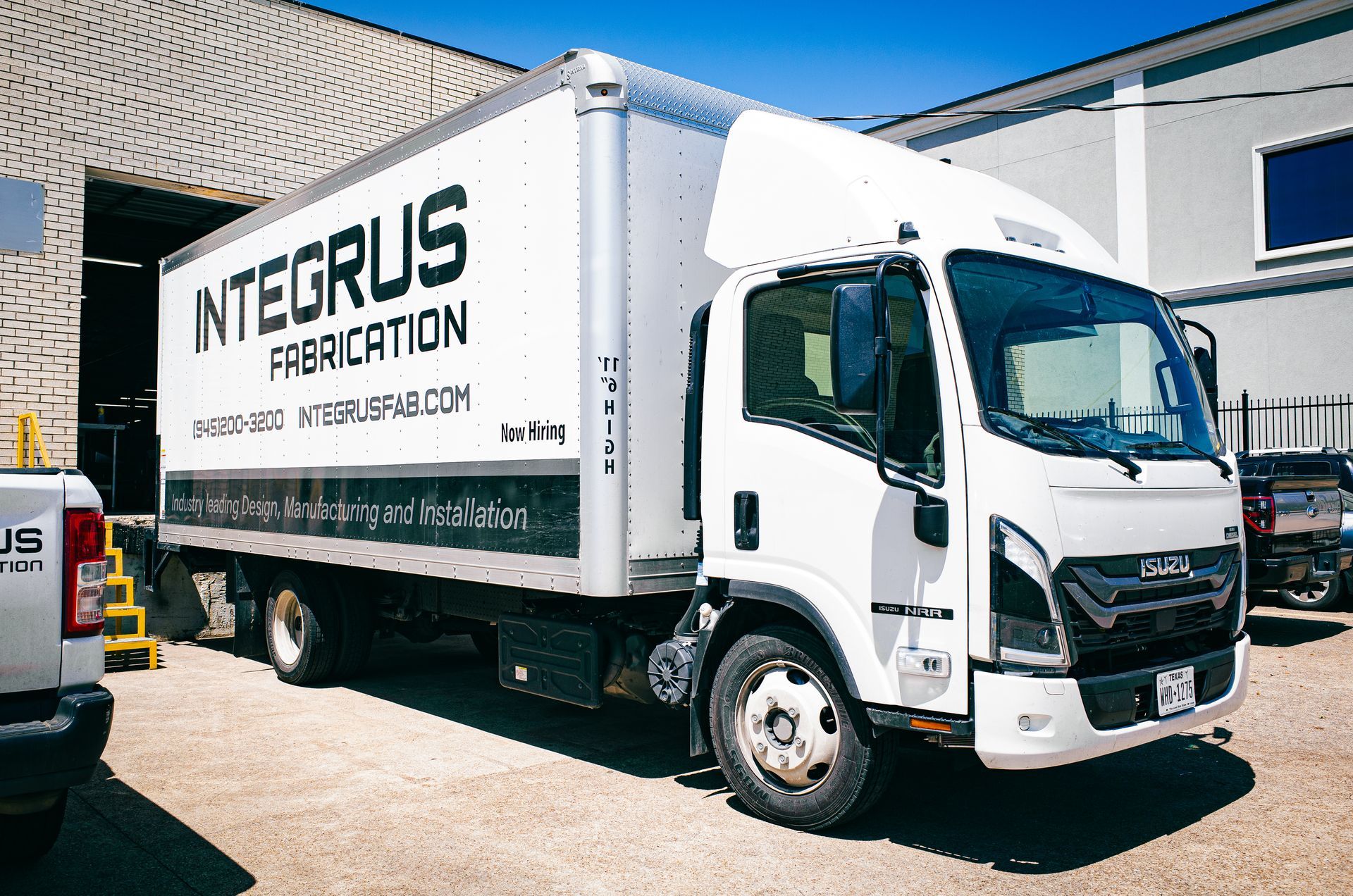 Integrus Fabrication truck parked on the company property
