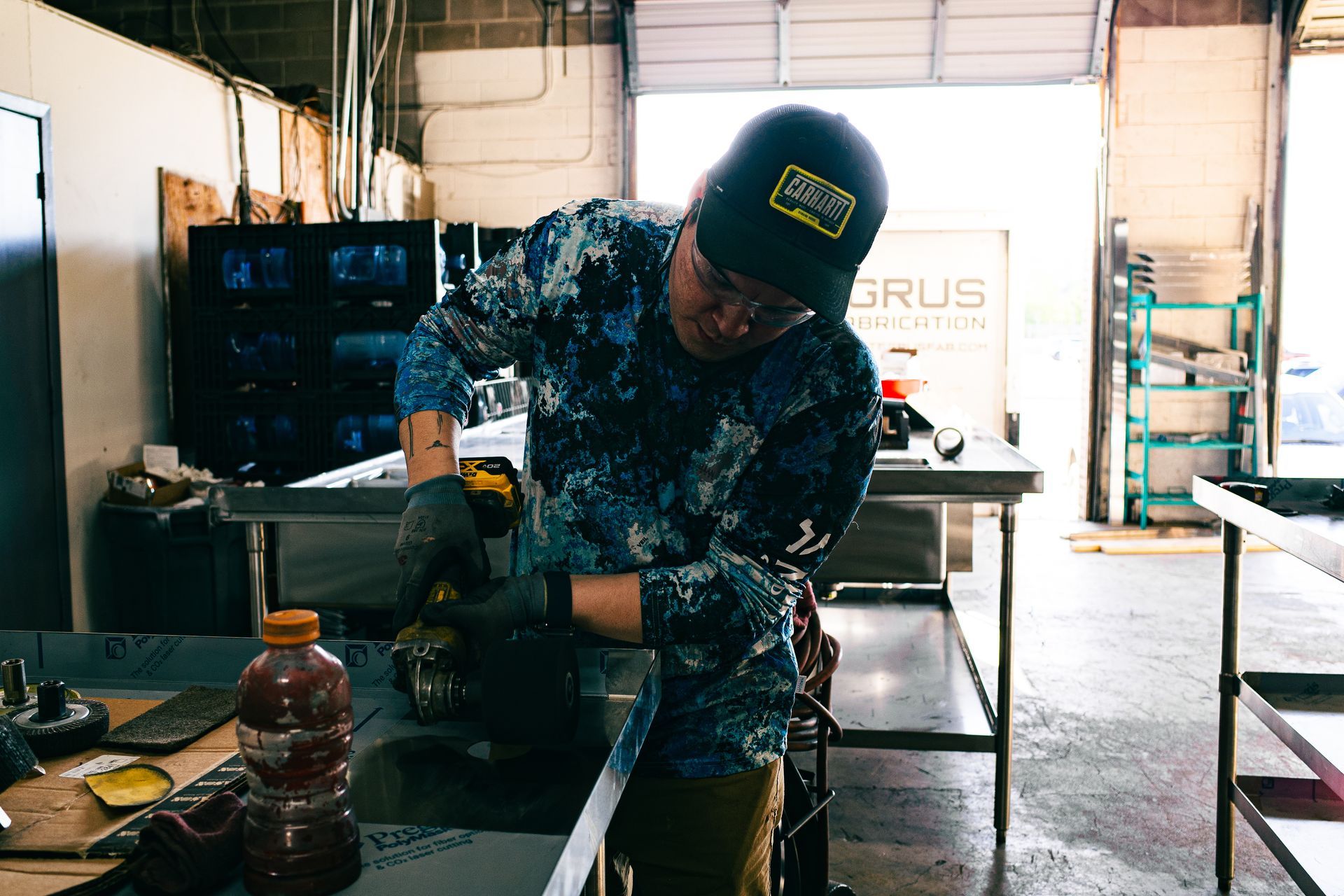 Integrus Team member polishing Food Service Equipment