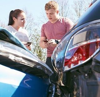 Two Drivers Exchange Insurance Details After Accident—Insurance in Burlington, NJ